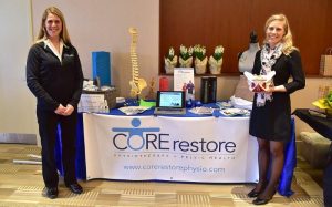 Core Restore vendor table at the International Women's Day Event 2017.