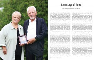 Penny and Gus Bogner holding a framed picture of their daughter Heidi with a Message of Hope article written beside.