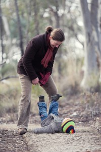 Photo of mother and son playing on walking trail