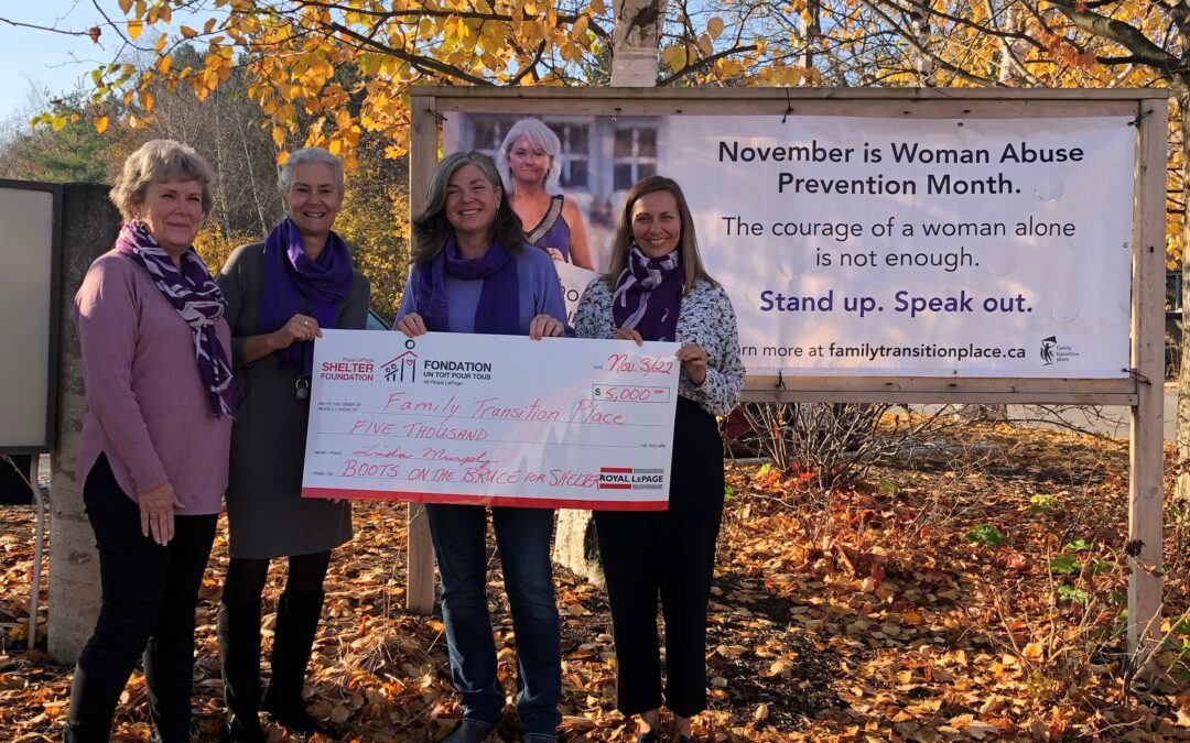 A cheque presentation outside on a fall day from Linda Murphy The Healthy Hiker and Bonnie, Norah and Kelly.