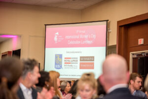 2020 International Womens Day event photo of slideshow presentation featuring all the event sponsors.