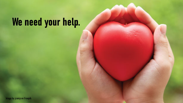 hands cupped holding rubber heart with text we need your help