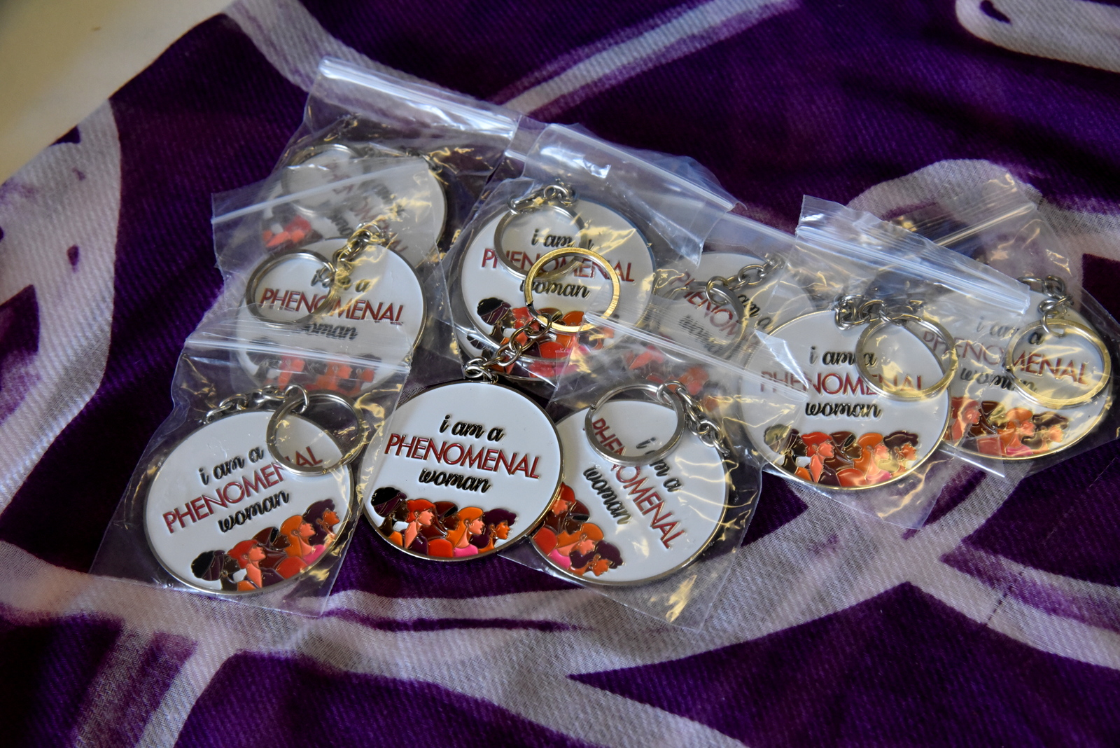 I am Phenomenal Woman keychains in a basket at Heidi's Walk for Hope September 2023.