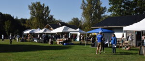 Vendor tables with tents set up outside at Heidi's Walk for Hope September 2023.