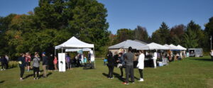 Participants enjoying the day at Heidi's Walk for Hope September 2023 with the vendor tables and tents.
