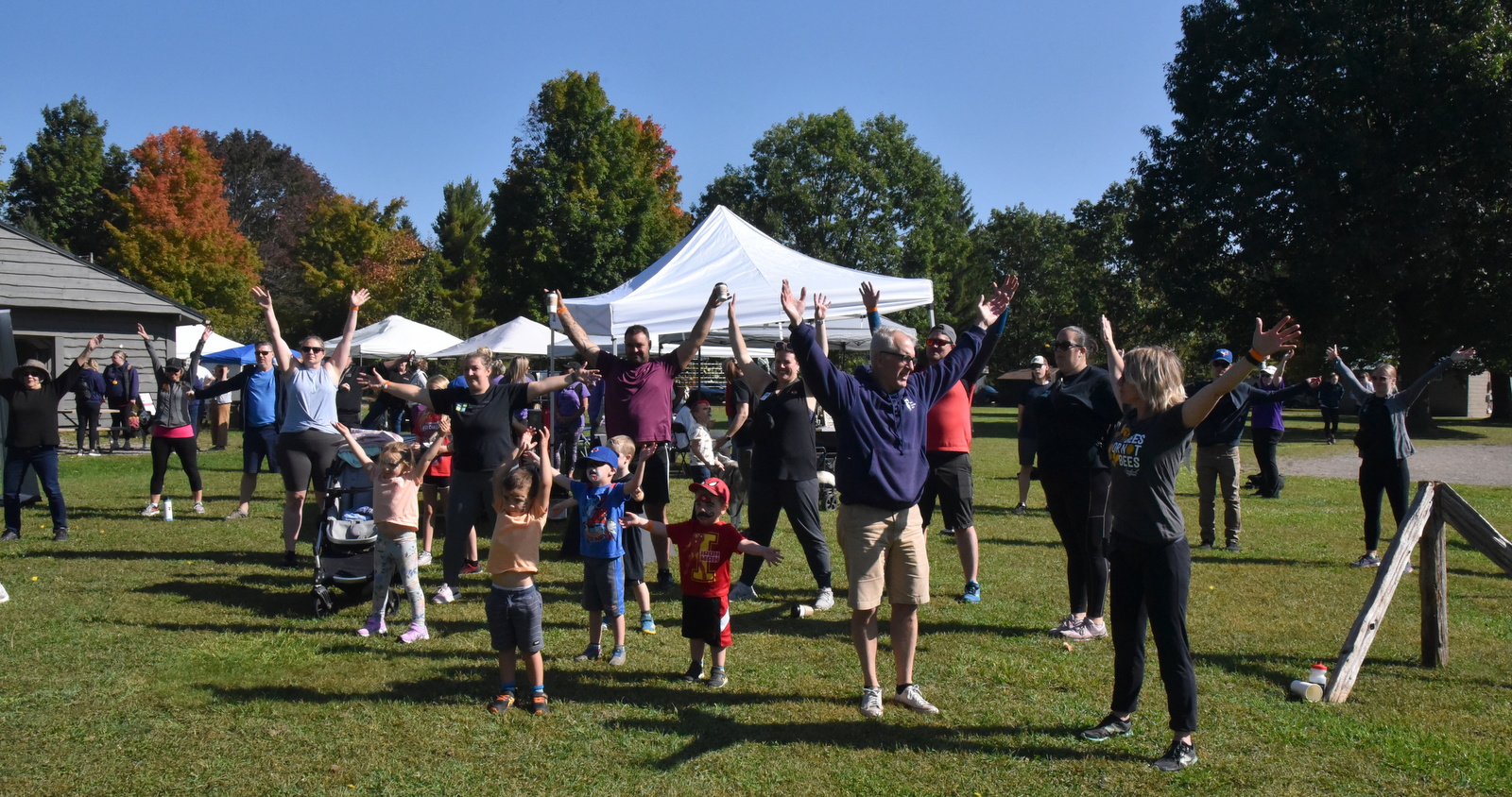 Heidi's Walk for Hope September 2023 participants taking part in a pre-walk stretch.