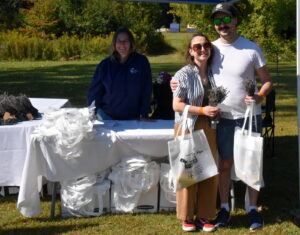 Proud participants of Heidi's Walk for Hope after completing the 5km walk holding their swag bags for participation.