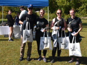 Proud participants from CCP Wellness of Heidi's Walk for Hope after completing the 5km walk holding their swag bags for participation.