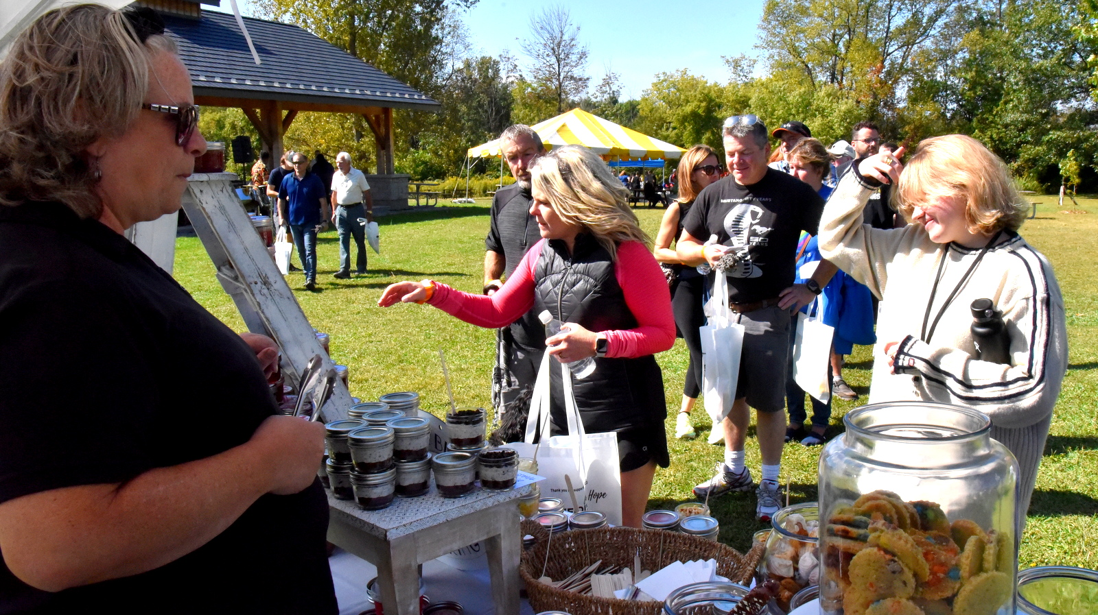 Participants lined up to get their yummy treats from Lavender Blue Catering table at Heidi's Walk for Hope September 2023.