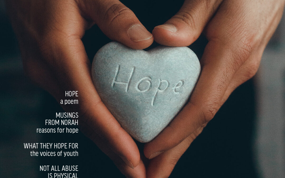 Family Transition Place's 2023 HOPE magazine cover black background with hands holding a heart-shaped rock with the word hope engraved into it.